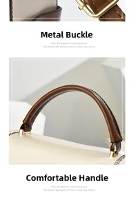 Detail of gold hardware clasp and brown leather handle on a chic two-tone handbag