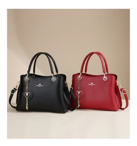 Front view of black and red leather tote bags with elegant gold heart chain charms