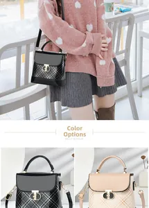 Detail of contrast color crossbody bag featuring patent leather and GD metal buckle