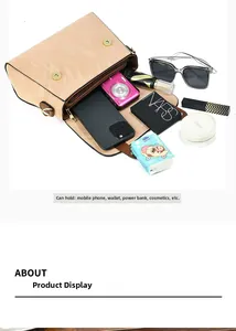 Intérieur spacieux d'un sac à bandoulière en cuir marron avec rangement pour téléphone