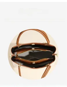 Detail view of the multi-compartment interior and magnetic closure of the tote bag