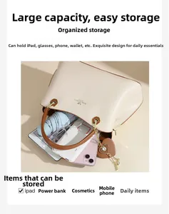 Detail showing high-capacity interior of beige tote bag with iPad and umbrella storage