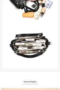 Detailansicht der geräumigen schwarzen Handtasche mit vielen Fächern und Innentaschen