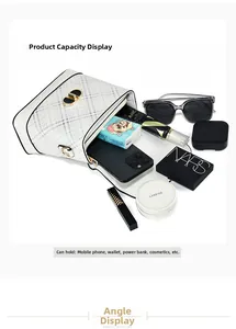 Interior storage view of a white plaid crossbody bag showing phone and cosmetics