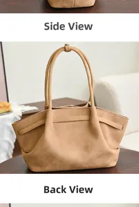 Close-up side view of a large apricot suede tote bag in a cozy home setting decor