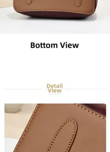 Detail of brown and burgundy pebbled leather handbag with precise stitching and flat base