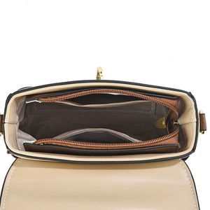 Chic beige crossbody box bag with gold zippers and organized brown interior storage