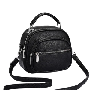 Retro black leather shoulder bag with pebble texture and multiple silver zipper pockets