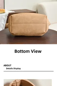 Detailed view of the stitched bottom and premium leather texture of the large tote bag