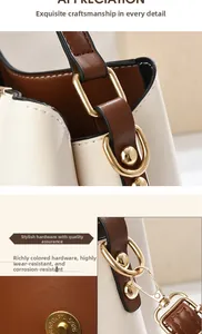 Close-up of premium gold-toned hardware and durable magnetic snap on the bucket bag