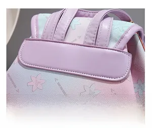 Detailed macro view of reinforced shoulder strap stitching on soft leather backpack