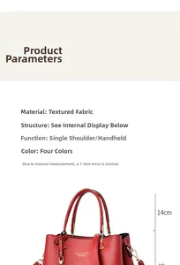 Detail view of red pebbled leather tote showing the 14cm handle height and shoulder strap