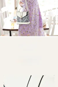 Detail of round gold buckle and colorful geometric print on crossbody bag