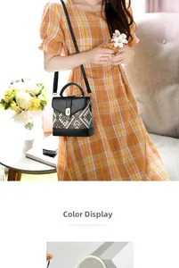 Detail of pixel-style crossbody bag showing geometric weave pattern and golden twist lock