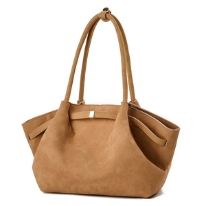 Large tan suede hobo bag with double handles and golden metallic buckle detail