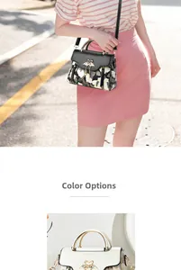 Detail of elegant two-tone handbags featuring golden swan buckles and floral pattern