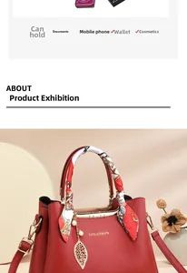 Detailed view of red lychee grain leather tote with silk scarf handle and golden leaf charm