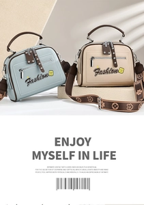 Detail view of contrast color handbags with floral wide straps and Fashion logo lettering