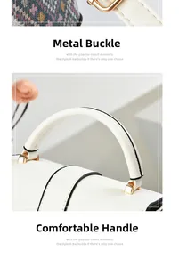 Detail of white mini bag featuring premium hardware clips and comfortable handles