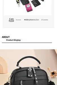 Detail showing high-capacity black pebbled leather handbag with double zipper compartments