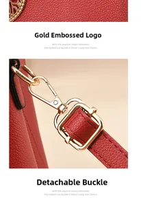Detail of red bridal tote featuring gold-plated removable hooks and embossed branding