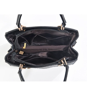 Detail view showing interior storage compartments and crocodile pattern on black tote bag