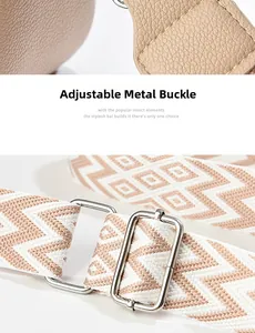 Detail of adjustable geometric patterned shoulder strap with durable silver metal buckles
