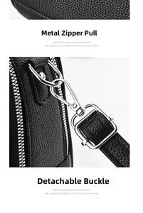 Detail of silver metal zipper and detachable swivel hook on black lychee leather bag