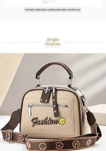 Detail of beige square bag capacity showing phone, wallet and star embroidery