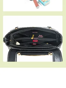 Vue intérieure du sac à main en cuir noir avec cinq compartiments et fermeture dorée