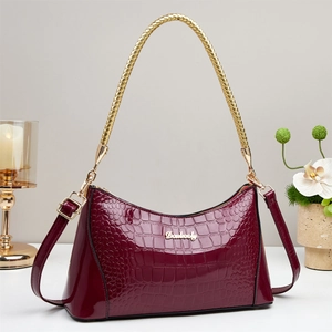 Glossy burgundy crocodile pattern leather handbag with gold metal handles and SPU details