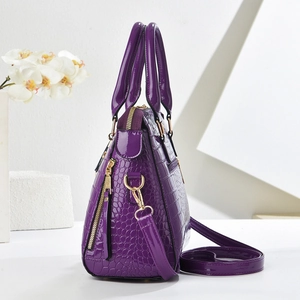 Dark purple glossy patent leather tote with crocodile pattern and gold hardware