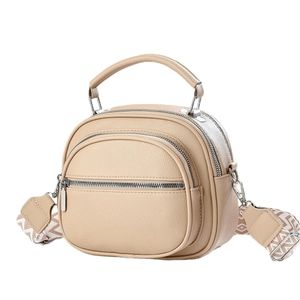 Chic beige pebbled leather handbag with wide geometric print strap for women