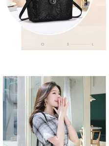 Detailed view of black snakeskin texture crossbody bag with metallic rotary lock closure