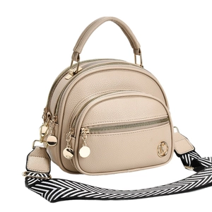 Three-layer beige crossbody bag with textured leather, gold K-logo and woven strap