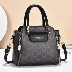 Grand sac à main gris foncé style ailes avec détails dorés et motifs imprimés