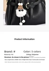 Detailed view of black PU leather handbag dimensions 28x13x20cm with cute plush charm
