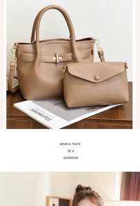 Detail of tan lychee pattern bucket bag set with gold hardware on wooden surface