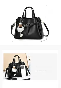 Detailed size chart of a black pebbled leather crossbody bag with bow charm accessory