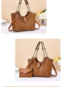 Close-up of brown crocodile pattern tote bag with gold chain handle and matching pouch