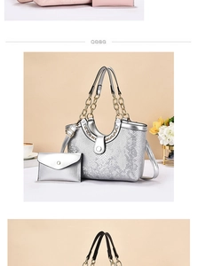 Detail of silver snake-pattern tote bag set with metallic chain handles and matching pouch