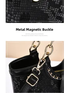 Detail of snake skin texture leather handbag with gold magnetic buckle and chain strap