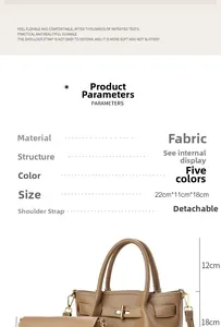 Detail view of brown textured leather tote bag with gold hardware and removable strap