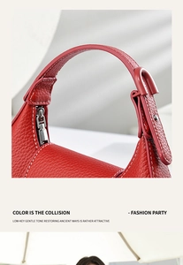 Détails du sac à main en cuir rouge avec fermeture éclair argentée et coutures blanches