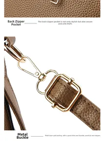 Detail of brown lychee leather bag featuring a secure back zipper and golden metal hooks