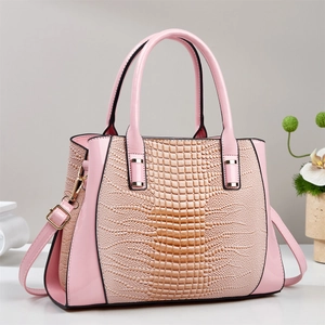 Pink croc-embossed large tote bag with gold hardware and removable shoulder strap