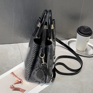 Fashionable dark grey faux leather backpack with snakeskin texture and gold hardware