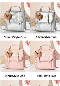Detail view of stylish small backpacks in silver and pink with quilted leather and bear charms
