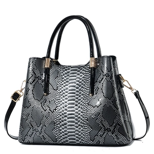 Chic black and gray python pattern faux leather backpack for women with gold hardware