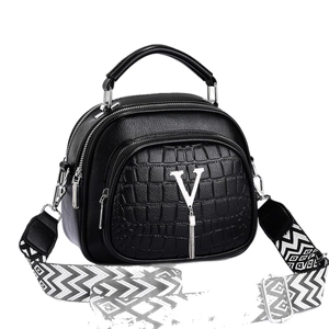Black textured leather handbag with V-logo and geometric wide shoulder strap